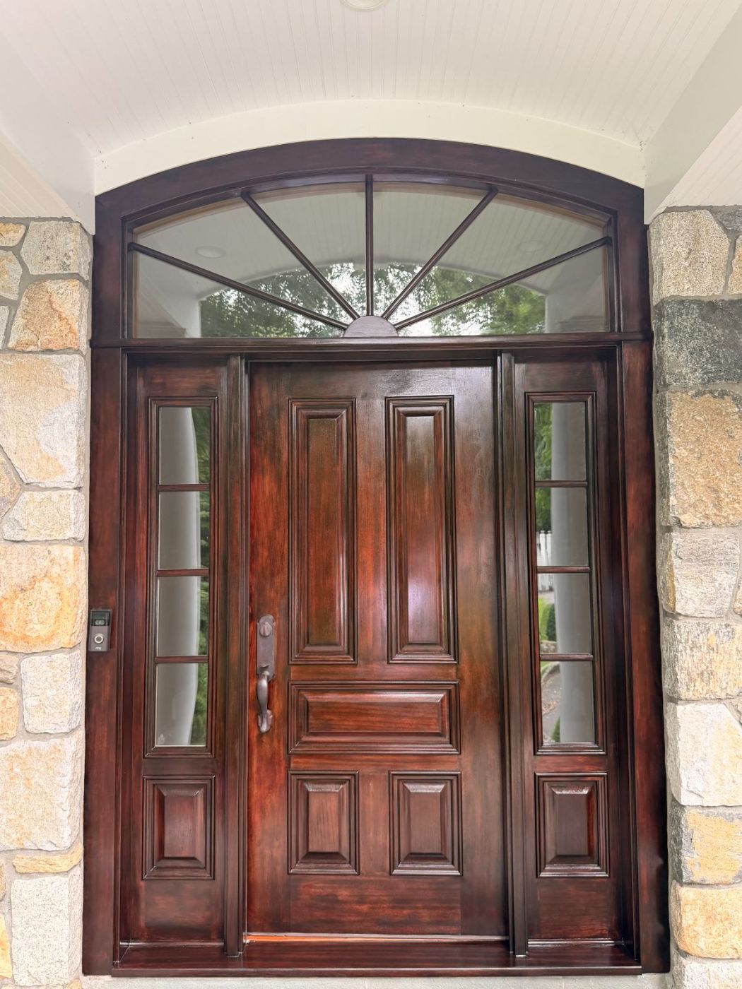 Restored arched mahogany entry door